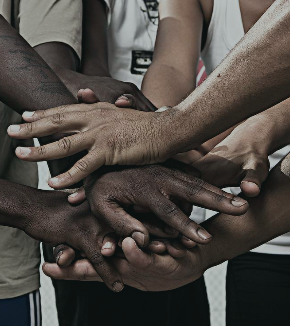 black people putting hands together